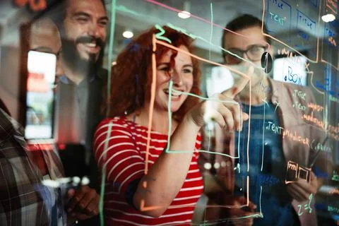 Happy software developers working on meeting, Programming advanced code 库存照片