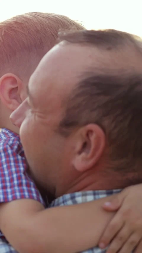 Happy son hugging his father outdoors Stock-Footage 340809397