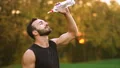 The happy sportsman pouring a water on yourself. slow motion 4k or 4k+ Resolution