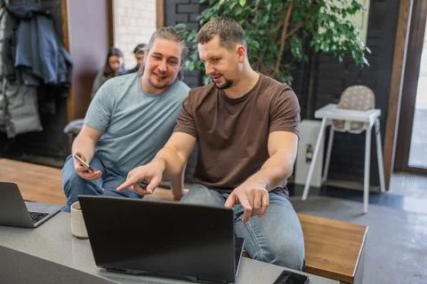 Happy start up team talking while having a break during working hours in modern Stock Photos