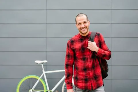 Happy student with backpack looking camera. Stock Photos