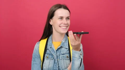 Happy student female activating virtual assistant on mobile phone Stock Footage 202895992