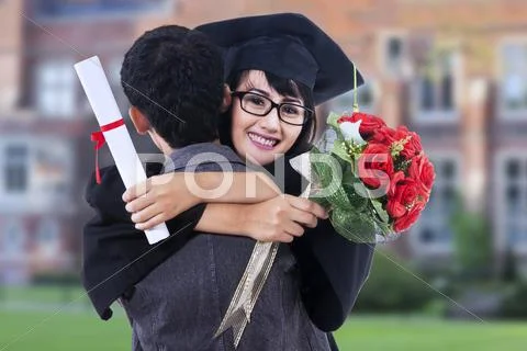 Happy student in graduation gown Stock Photos