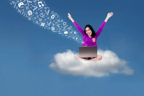 Happy student with laptop on the cloud Foto stock