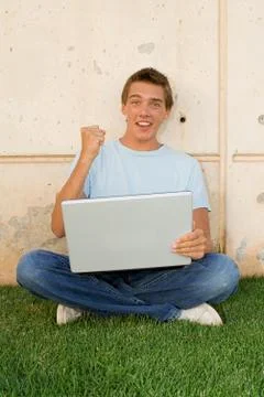 Happy student with laptop computer Stock Photos