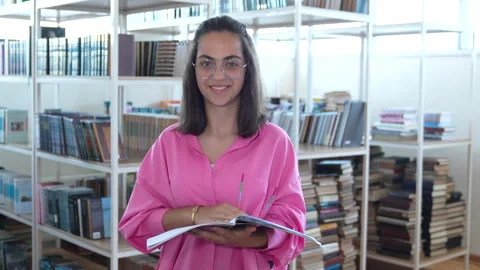 Happy student leafing through a notebook Stock Footage 244949797