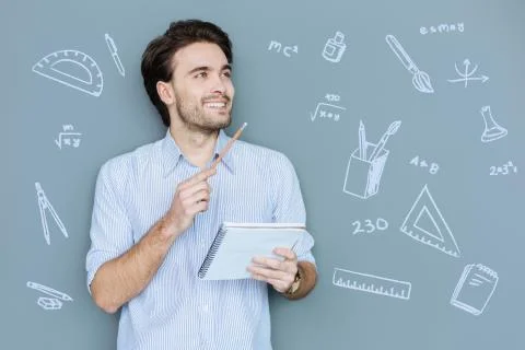 Happy student looking glad while being at the Math lesson Stock Photos
