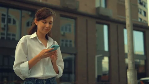 Happy student scrolling touch screen on mobile Stock Footage 134497799
