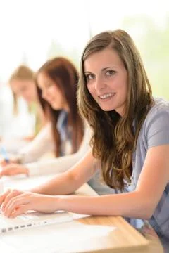 Happy students in classroom Stock Photos