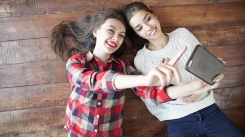 Happy students girls watching the smart phone in classroom Stock Footage 59342250