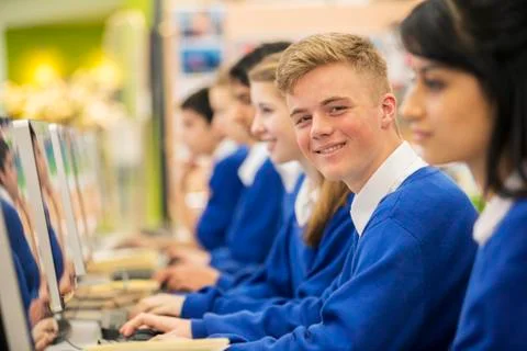 Happy students learning in computer room Foto stock