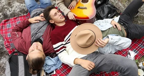 Happy students lying on ground and chatting Stock Footage 96091276