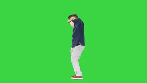 Happy stylish boy doing some cool dancing on a Green Screen, Chroma Key. Stock Footage 147372591