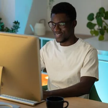 Happy successful programmer enjoy working from home on remote or freelance Stock Photos