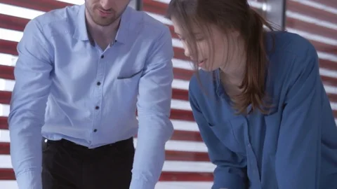 Happy supportive group of colleagues discussing in the meeting Stock Footage 73865299