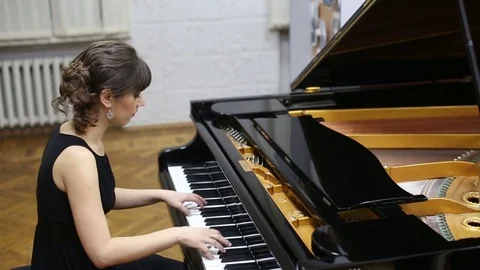 Happy talented young lady playing grand piano Stock Footage 72628891