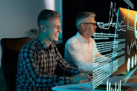 Happy Team of Analysts Working on Data Visualization in a Modern Office Foto stock