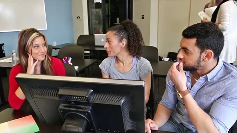 Happy Team Discussing Work on Flatscreen Monitor Collaborating Diverse Group Stock Footage 80166214