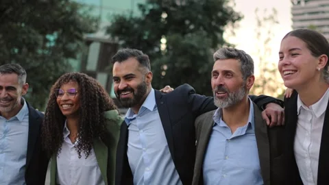 Happy team of multi ethnic professionals standing and smiling in the city Stock Footage 306658996
