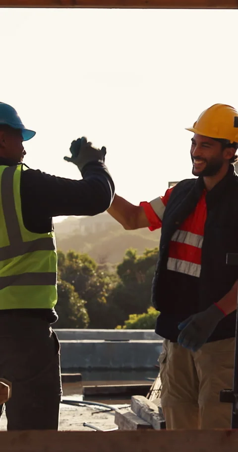 Happy, team or men with high five at construction site, development milestone or Stock Footage 336780213