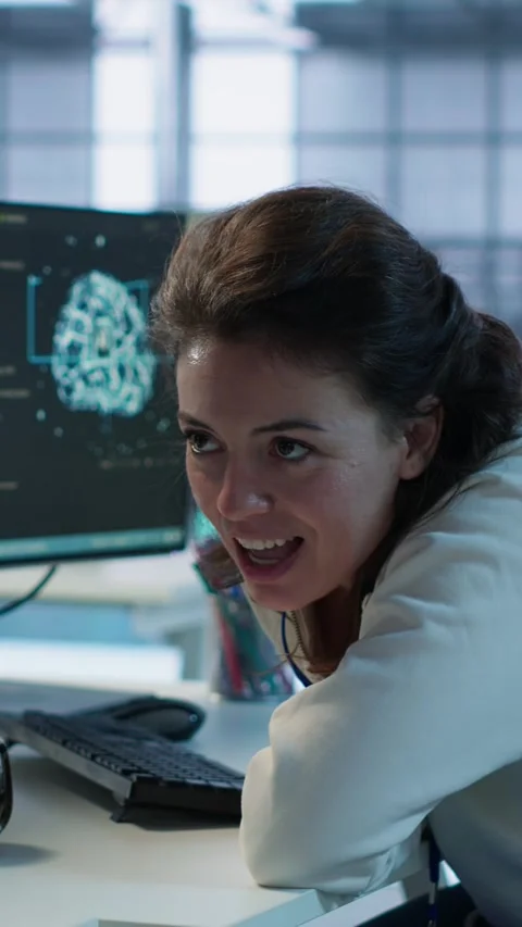 Happy technician chatting with colleague while doing maintenance on AI systems Stock Footage 319530079