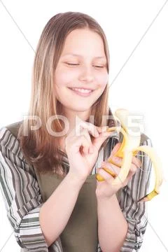 Happy teen girl with banana Stock Photos