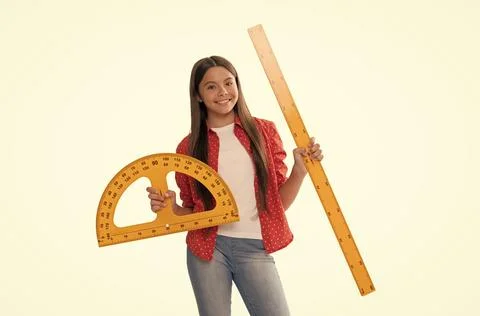 Happy teen girl hold protractor ruler measuring size and angle degree at school Stock Photos