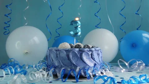 Happy third birthday navy cake and number three candle with blue balloons 動画素材 198534868