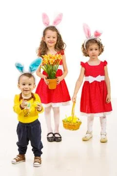 Happy three brothers with Easter eggs Foto stock