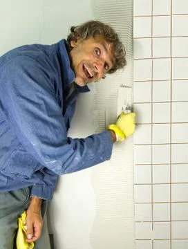 Happy tiler Stock Photos