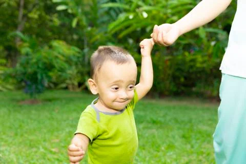 Happy Toddler Boy Learning to Walk Stock Photos
