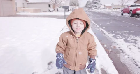 Happy Toddler Experiencing His First Snow Stock Footage 345270831