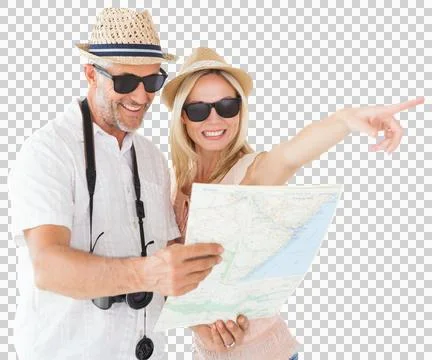 Happy tourist couple using map and pointing Fotos Stock