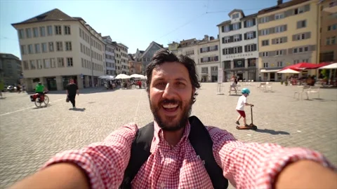 Happy tourist man taking a selfie photo in Zurich, Switzerland Stock Footage 157447731
