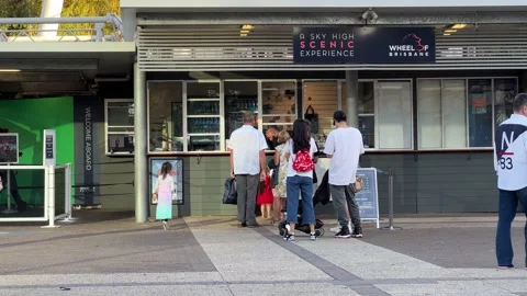 Happy tourists lining up at the ticket counter to go on gondola ride on Stock Footage 209501772