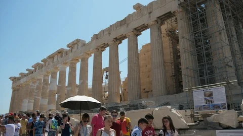Happy tourists moving inside in Acropolis, Athens on a sunny day in summer Stock-Footage 117715917