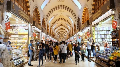 Happy tourists walk between shops and stores in turkish mall Stock Footage 120237102