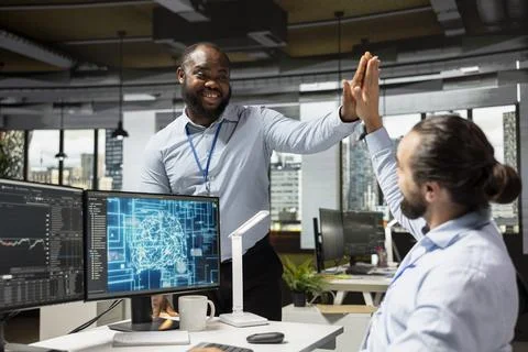 Happy traders doing high five, pleased after gaining money by using AI Stock Photos