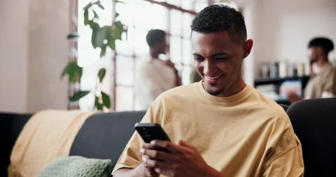 Happy, typing and man on sofa, smartphone for social media and digital app for Stock Footage 331647278