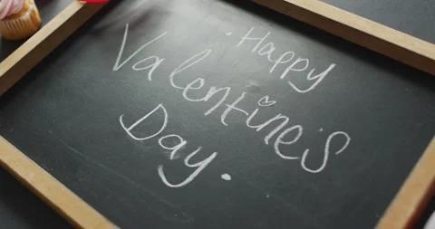 Happy valentine's day text and cupcakes on gray background Stock Footage 337223867