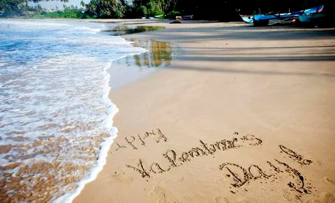 "Happy Valentines day!" written in sand on tropical beach - vintage photo Stock Photos