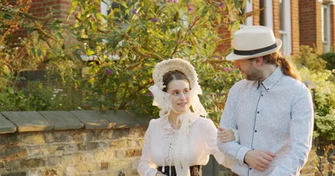 Happy victorian couple walk down the str... | Stock Video | Pond5