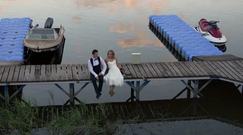 Happy wedding couple on jetty Video stock 66936645