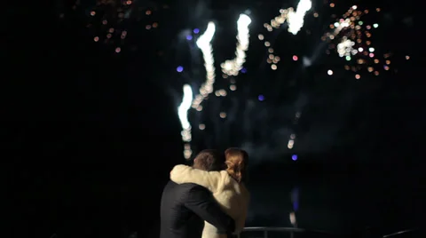 Happy wedding couple watching fireworks salute Stock Footage