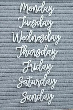 Happy weekdays posters embedded on grey background Stock Photos