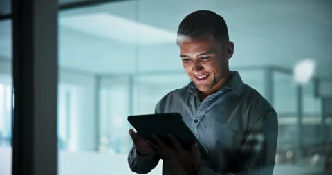 Happy, window and businessman on tablet at night for research, investment review Stock Footage 341410071