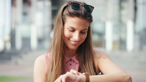 Happy, woman and checking time with watch in city for schedule, appointment or Stock Footage 336695048