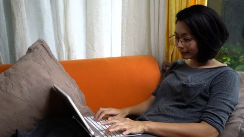 Happy woman at computer at home for E-learning.  Education online concept Stock Footage 127575248