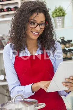 Happy Woman Cooking With Tablet Computer in Kitchen Stock Photos