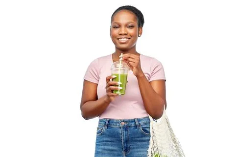 Happy woman with drink and food in reusable bag Stock Photos